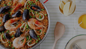 Ingredients for Paella which is a traditional Spanish dish of seafood and rice cooked in a large steel pan known as a paellera.